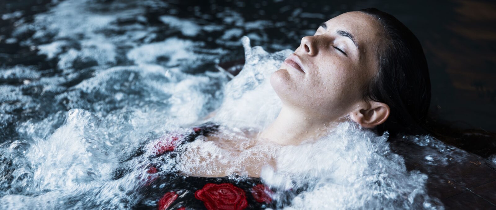 Women relaxing in a pool.