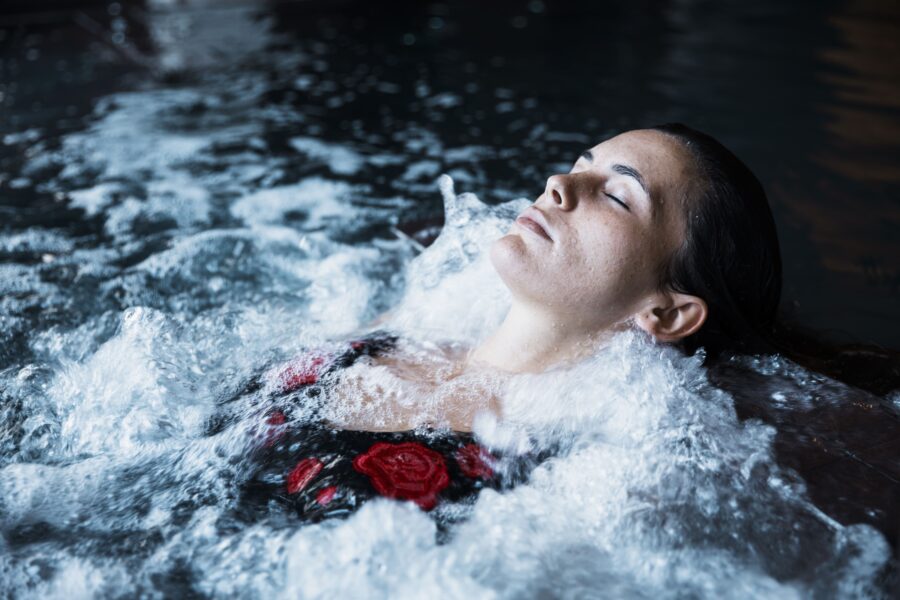 Women relaxing in a pool.